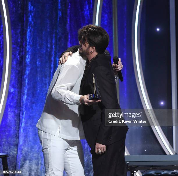 Dan Reynolds accepts the Hollywood Documentary Award from Adam Lambert onstage during the 22nd Annual Hollywood Film Awards at The Beverly Hilton...