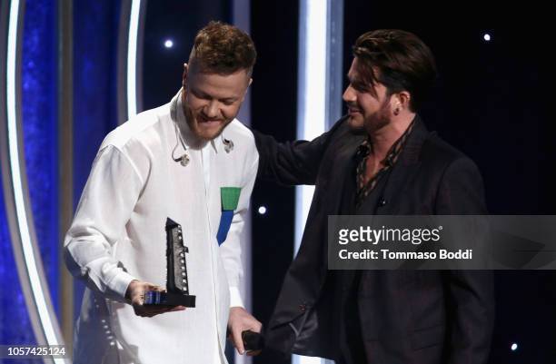 Dan Reynolds accepts the Hollywood Documentary Award for "Believer" from Adam Lambert onstage during the 22nd Annual Hollywood Film Awards at The...