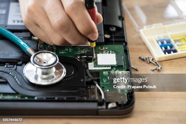 computer literacy repair men hands, man examines laptop clean thermal paste - computer repair background stock pictures, royalty-free photos & images