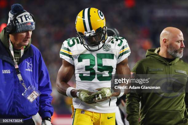 Jermaine Whitehead of the Green Bay Packers is ejected from the game after slapping David Andrews of the New England Patriots in the first half at...