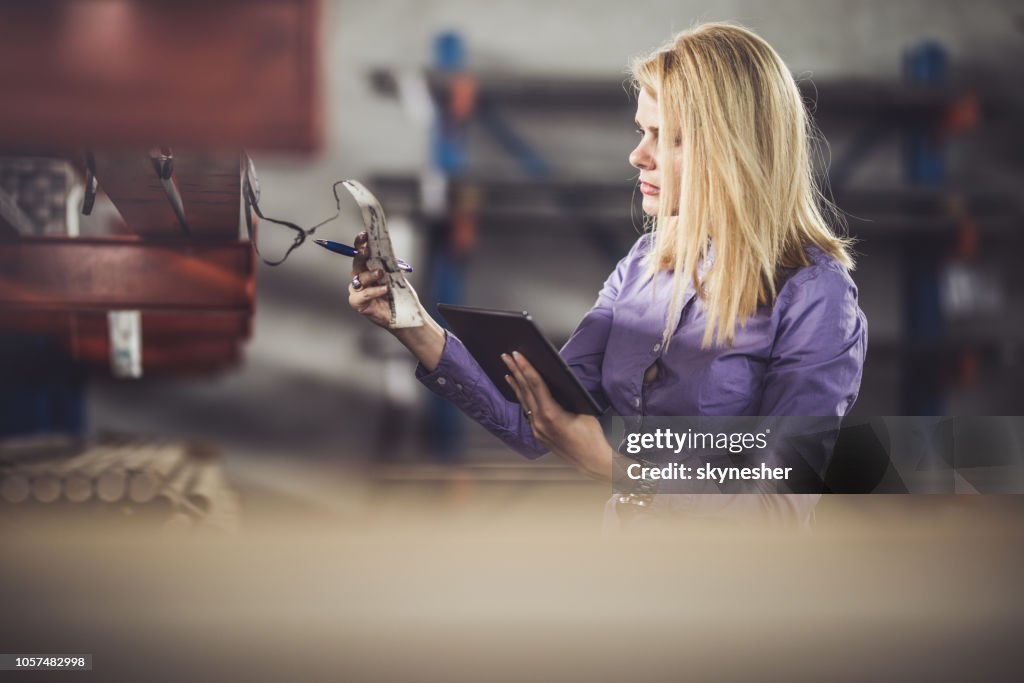 Woman Quality Control Female Quality Control Inspector Analyzing Labels In Industrial ...