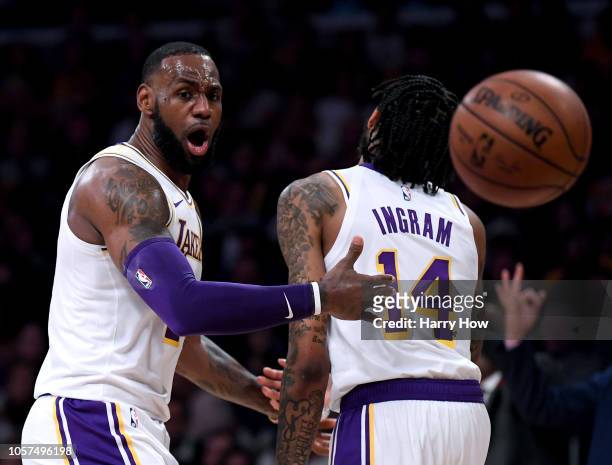 LeBron James and Brandon Ingram of the Los Angeles Lakers react to a Laker foul during the first half against the Toronto Raptors at Staples Center...