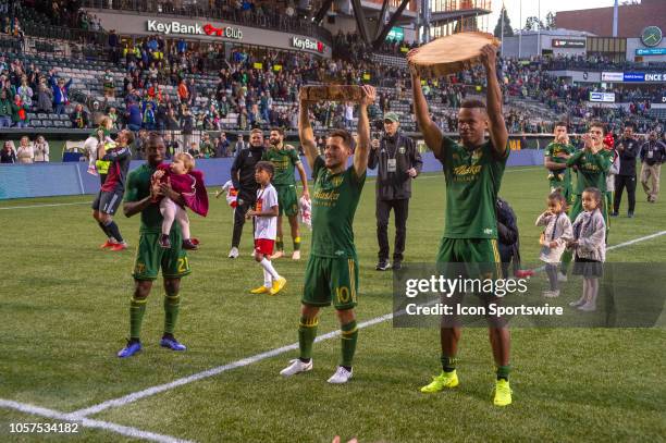 Portland Timbers striker Jeremy Ebobisse and midfielder Sebastián Blanco receive their slab trophies for their goals after the Portland Timbers 2-1...