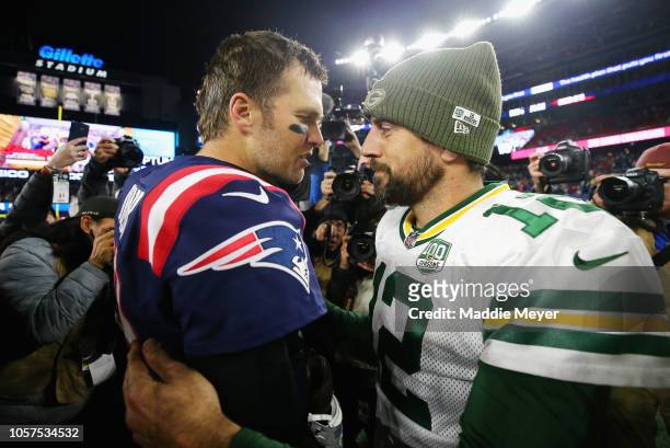 Tom Brady of the New England Patriots talks with Aaron Rodgers of the Green Bay Packers after the Patriots defeated the Packers 31-17 at Gillette...