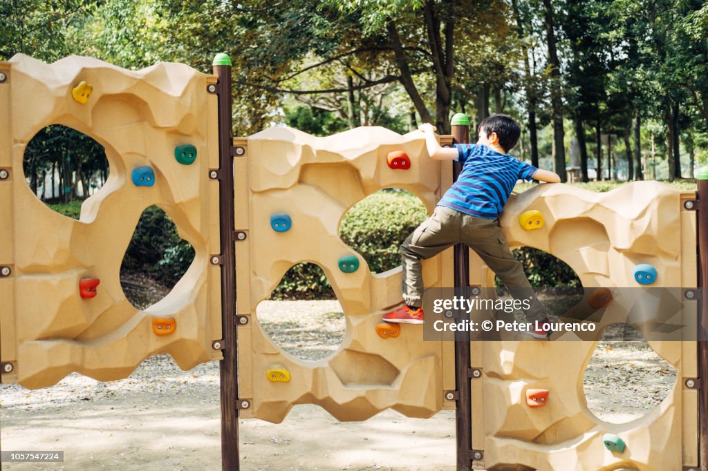 Young boy climbing