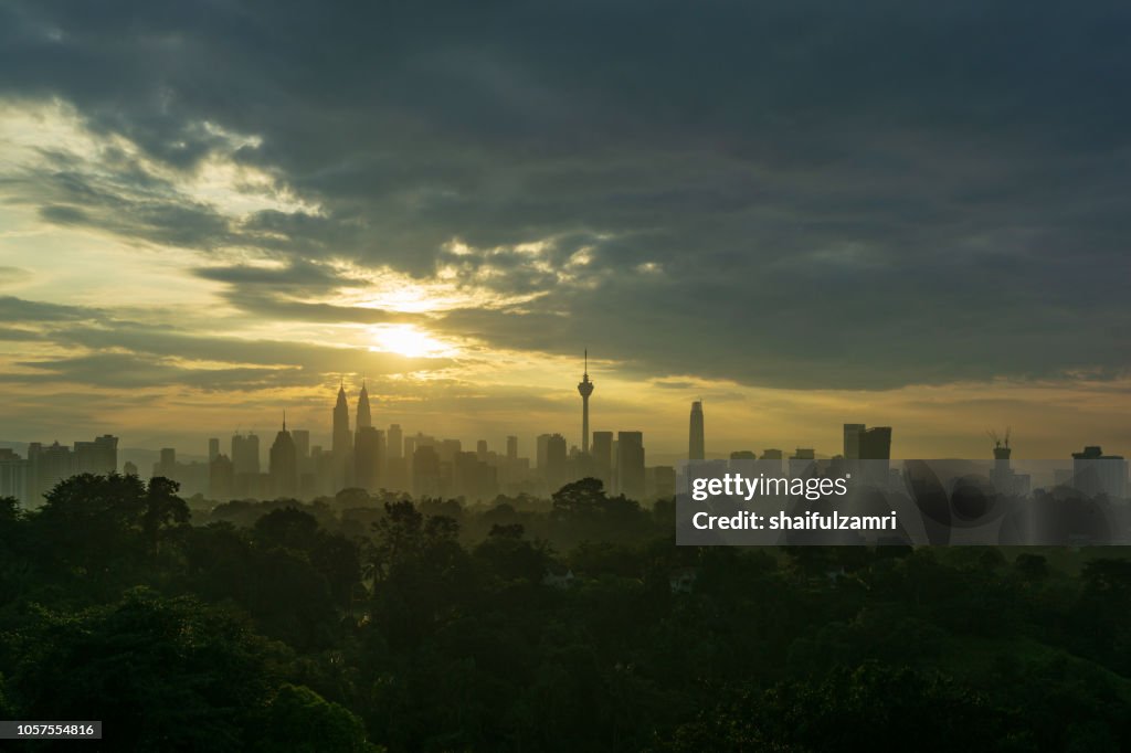 View of cloudy sunrise over downtown Kuala Lumpur, Malaysia