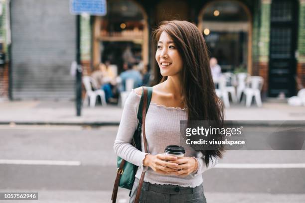 young student in the city - chinese ethnicity stock pictures, royalty-free photos & images