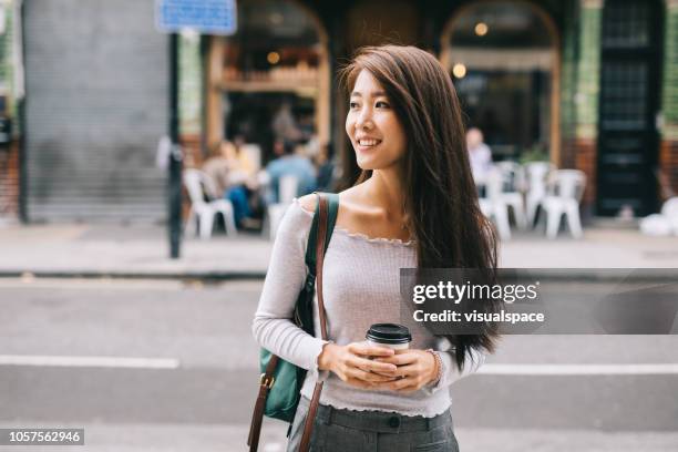 young student in the city - mulher chinesa imagens e fotografias de stock