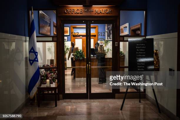 Tribute to those who were killed at the mass shooting at the Tree of Life Synagogue is seen outside's the mayors office at Pittsburgh City Hall on...