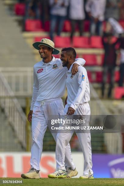 Bangladesh cricket Captain Mohammad Mahmudullah celebrates his teammate Nazmul Islam after the dismissal of the Zimbabwe cricketer Brandon Mavuta...