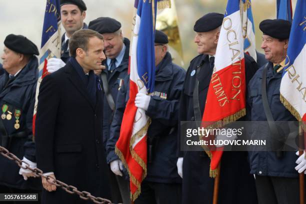 French President Emmanuel Macron greets veterans during a ceremony in tribute to the French soldiers killed in August 1914 during border battles, at...