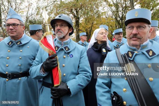 History enthusiasts, dressed with vintage army uniforms as Poilu , are pictured during a ceremony in tribute to the French soldiers killed in August...