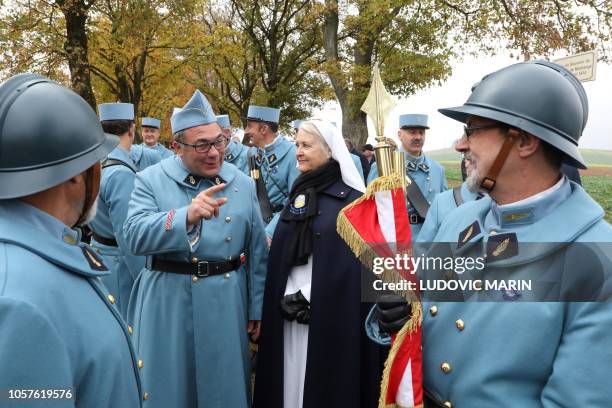 History enthusiasts, dressed with vintage army uniforms as Poilu , are pictured during a ceremony in tribute to the French soldiers killed in August...