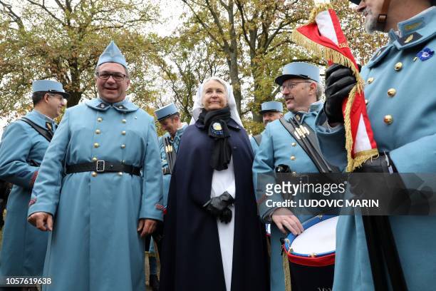 History enthusiasts, dressed with vintage army uniforms as Poilu , are pictured during a ceremony in tribute to the French soldiers killed in August...