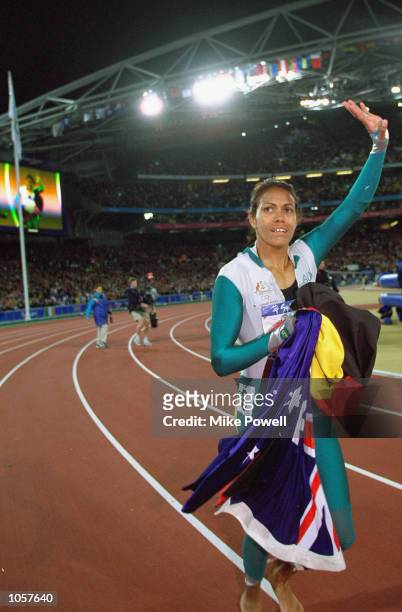 Cathy Freeman of Australia celebrates winning Gold in the Womens 400m Final at the Olympic Stadium on Day Ten of the Sydney 2000 Olympic Games in...