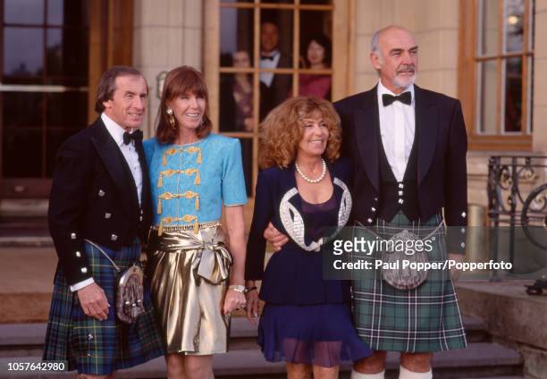 Scottish motor racing driver Jackie Stewart with his wife Helen and Scottish actor Sean Connery with his wife Micheline Roquebrune prior to attending...