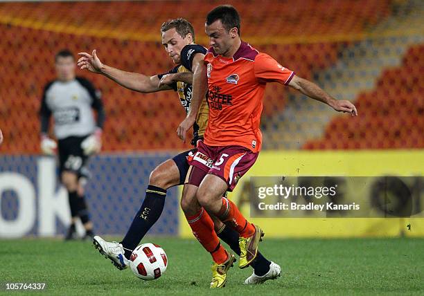 Ivan Franjic of the Roar is challenged by the defence during the A-League match between the Brisbane Roar and the Central Coast Mariners at Suncorp...
