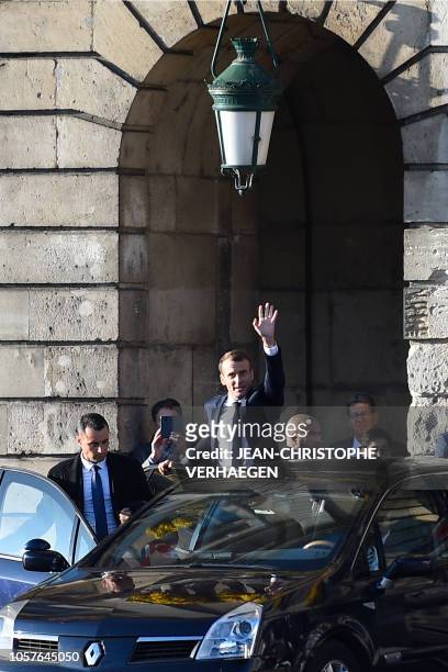 French President Emmanuel Macron waves before entering his car following a ceremony in tribute to the French soldiers killed in August 1914 during...