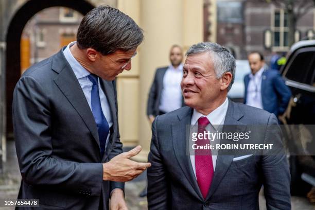 Dutch Prime Minister Mark Rutte greets Jordan's King Abdullah II at the ministry of General Affairs in the Hague on November 5, 2018. - Jordan's King...