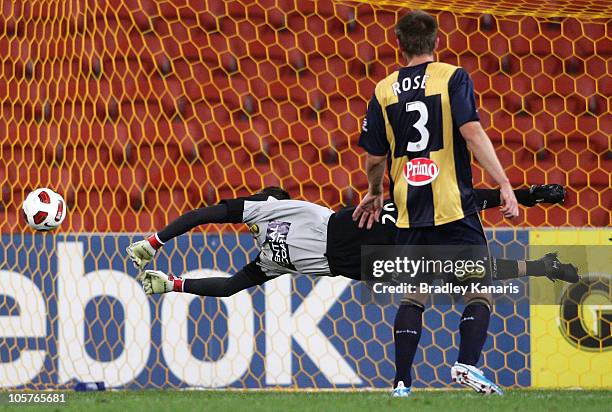 Goalkeeper Paul Henderson of the Mariners dives to save a goal during the A-League match between the Brisbane Roar and the Central Coast Mariners at...