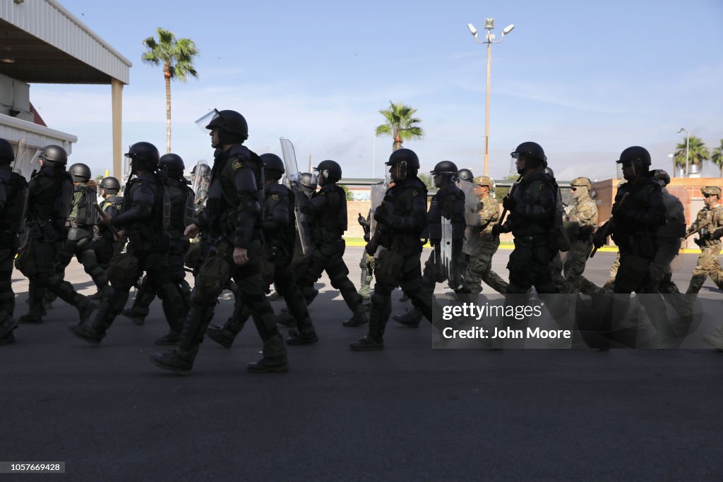 U.S. Border Patrol agents in riot gear take part in a Customs and ...