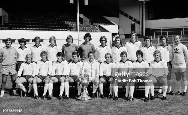 The Derby County squad pose for a team photograph with the League Championship trophy they won the previous season during a pre-season photo-call at...