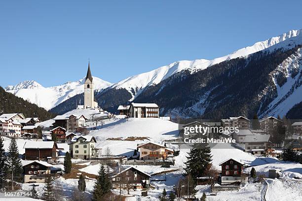 mountain village in winter alps near davos - davos switzerland stock pictures, royalty-free photos & images