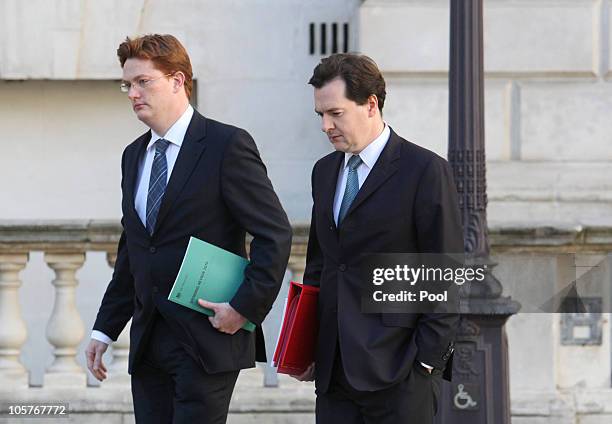 Britain's Chancellor of the Exchequer George Osborne and Chief Financial Secretary to the Treasury Danny Alexander leave the Treasury building for...