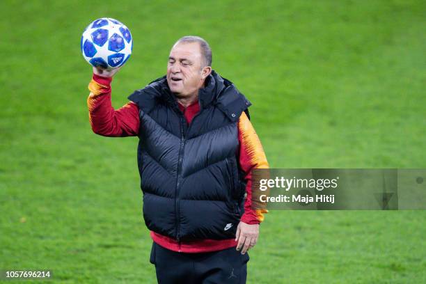 Fatih Terim head coach of Galatasaray plays with the ball during the Training prior to the Group D match of the UEFA Champions League between FC...