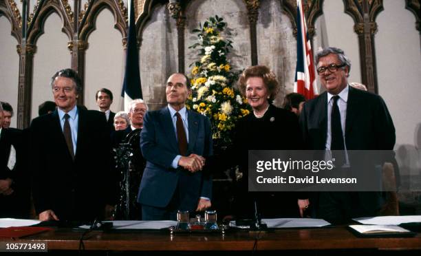French Foreign Minister Roland Dumas, French President Francois Mitterrand, British Prime Minister Margaret Thatcher and British Foreign Secretary...