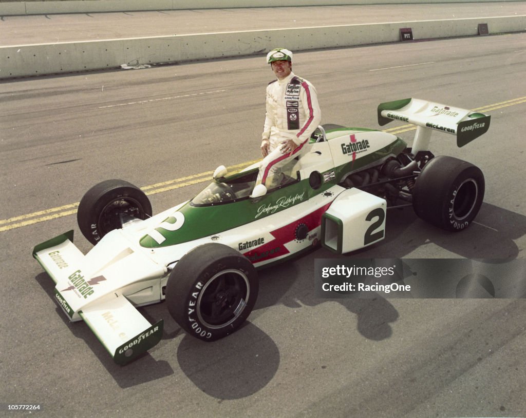 Johnny Rutherford Driver Johnny Rutherford poses with his Gatorade-sponsored Team McLaren M16 ...
