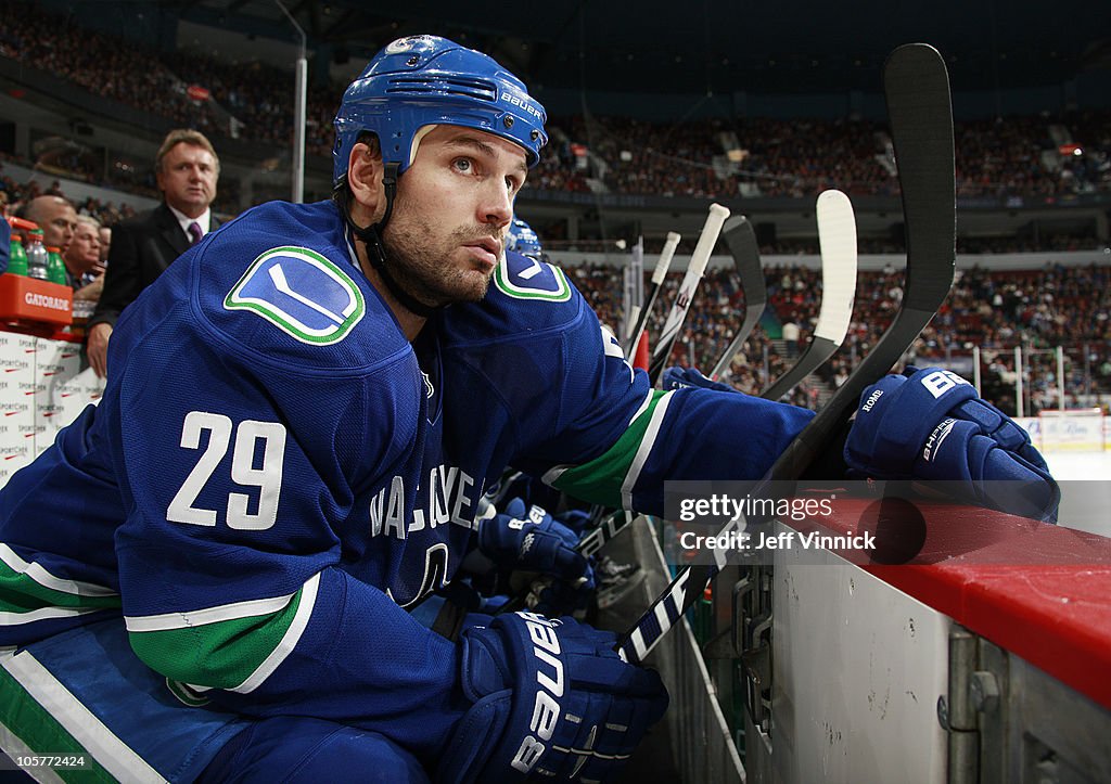 Aaron Rome Aaron Rome of the Vancouver Canucks looks on from the bench during ...