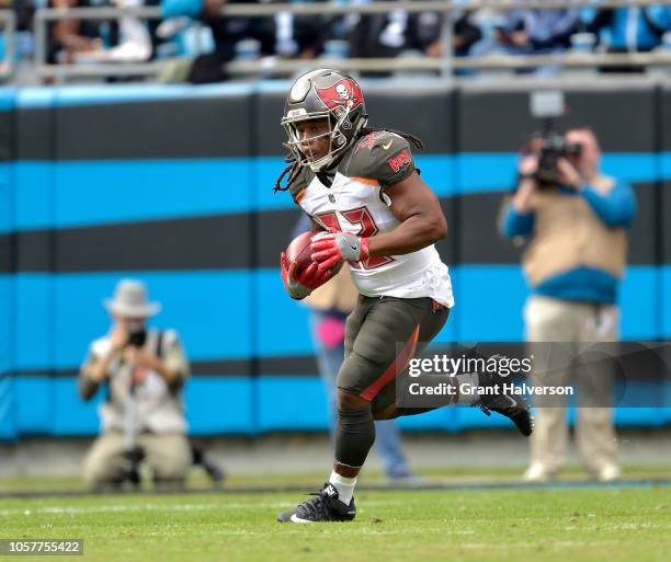 Jacquizz Rodgers of the Tampa Bay Buccaneers runs against the Carolina Panthers during their game at Bank of America Stadium on November 4, 2018 in...