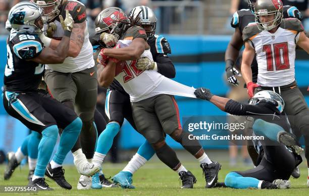 Jacquizz Rodgers of the Tampa Bay Buccaneers runs against the Carolina Panthers during their game at Bank of America Stadium on November 4, 2018 in...