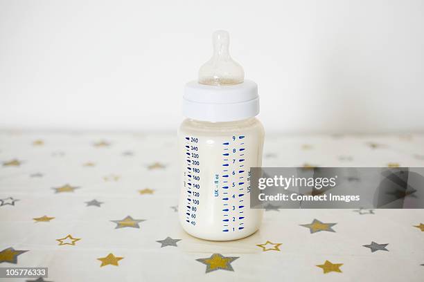 baby's bottle - baby bottle stock pictures, royalty-free photos & images