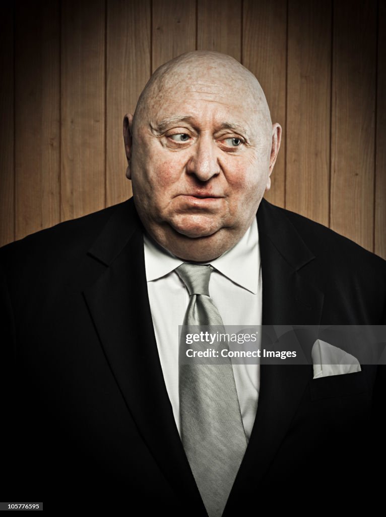 Studio portrait of sad senior man