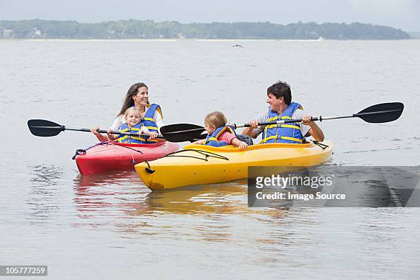 couple and daughters kayaking - hilton head stock pictures, royalty-free photos & images