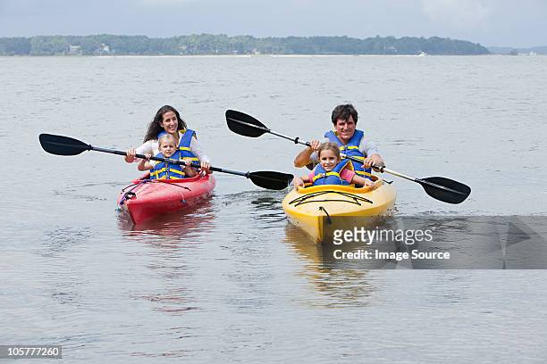 couple and daughters kayaking - hilton head stock pictures, royalty-free photos & images