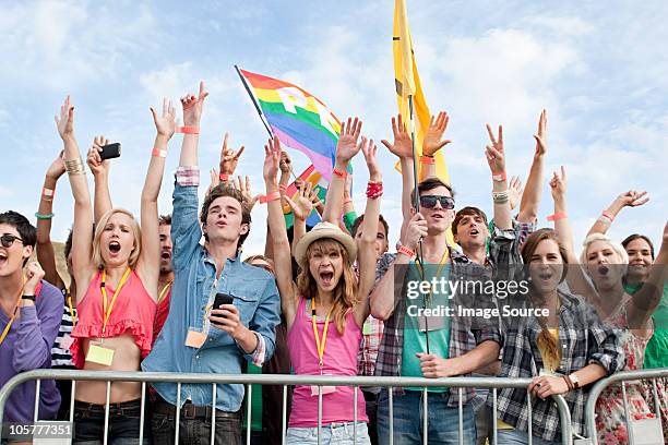 young people cheering at festival - pop musician stock pictures, royalty-free photos & images