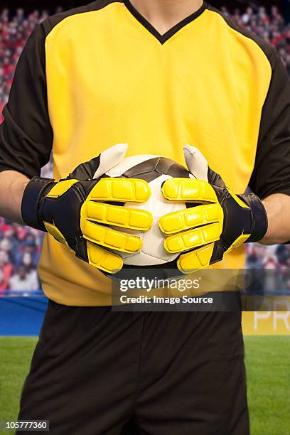 goalkeeper holding football - gul handske bildbanksfoton och bilder