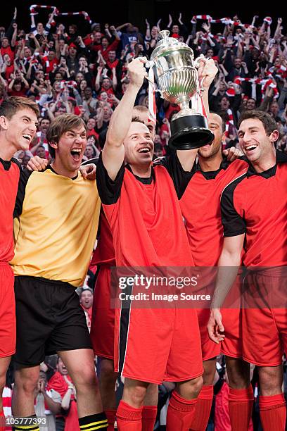 football team winning a trophy - london football awards stock pictures, royalty-free photos & images