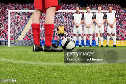 Free kick during a football match Free kick during a football match