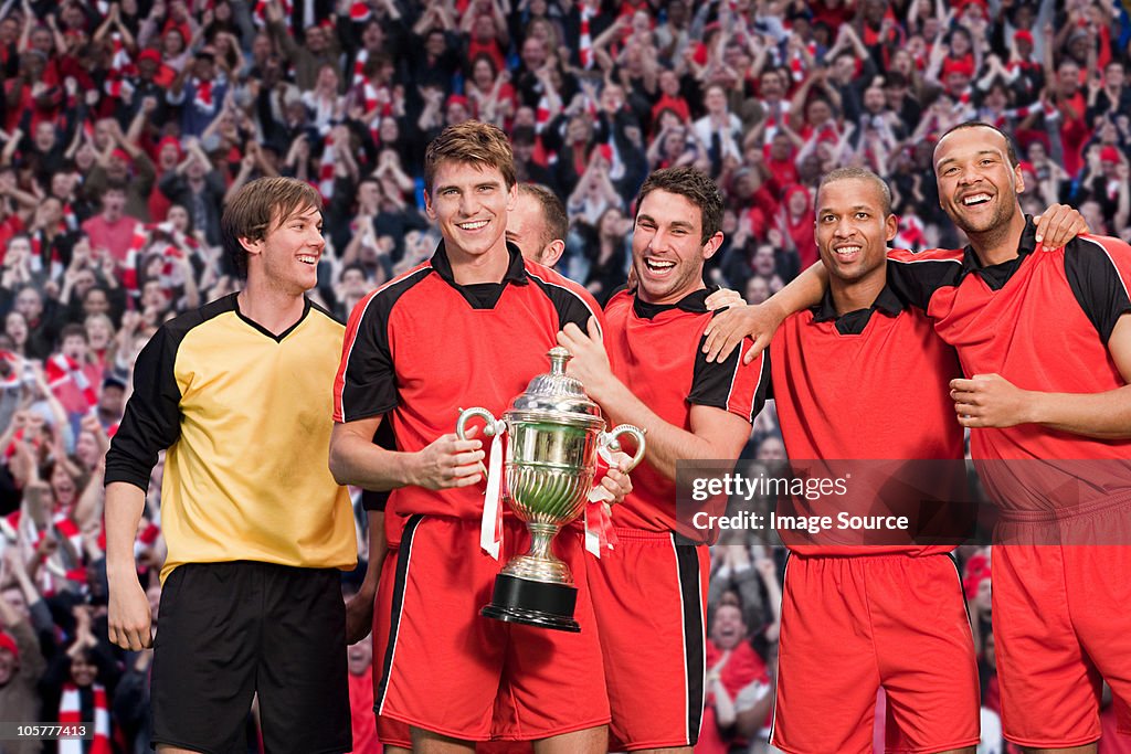 Equipo de fútbol con trophy