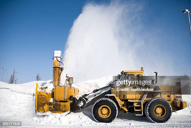 snow blower in action - sneeuwmachine stockfoto's en -beelden