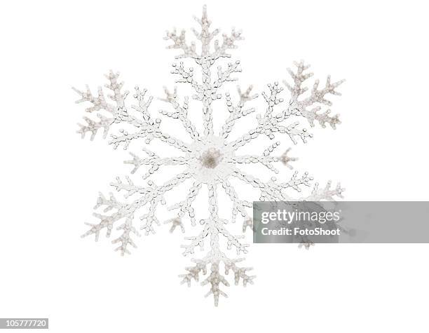 single glitter snowflake isolated on a white background - fotoshoot stock pictures, royalty-free photos & images