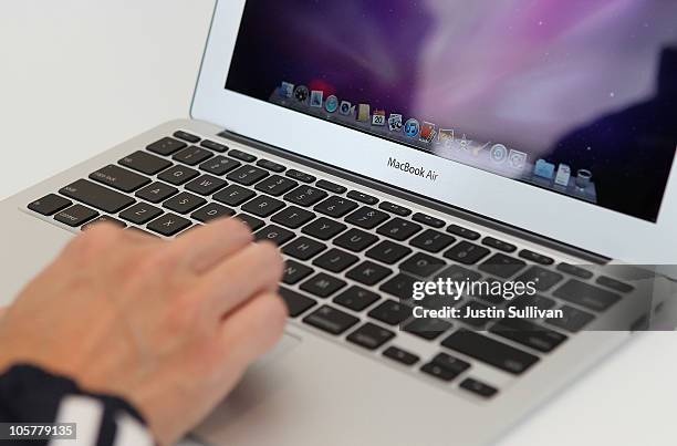 Member of the media looks at a display of the new Mac Book Air during an Apple special event at the company's headquarters on October 20, 2010 in...