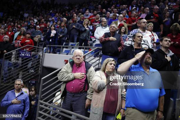 Attendees stand for the Star Spangled Banner during a campaign rally for Mike Braun, Republican U.S. Senate candidate from Indiana, featuring U.S....