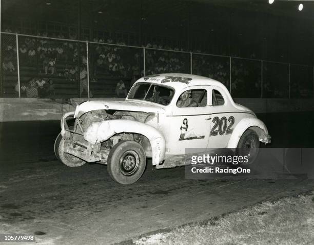 Wendell Scott, who would go on to a career on the NASCAR Cup circuit beginning in 1961, at the wheel of one of his Modified cars.