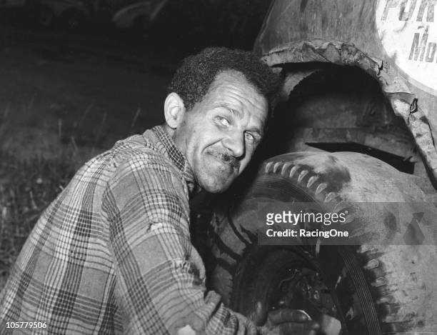 Wendell Scott works on one of his Modified stock cars, circa 1955. Scott would go on to run 495 NASCAR Cup races and is the only African-American...