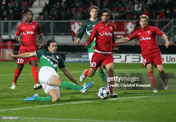 Claudio Pizarro of Bremen misses a ball against Douglas of Enschede , Bryan Ruiz and Rasmus Bengtsson of Enschede during the UEFA Champions League...